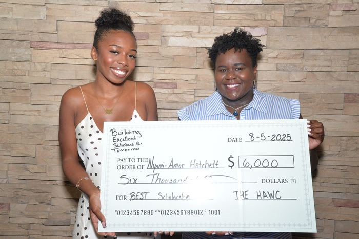 Scholars receiving a BEST award check in 2025